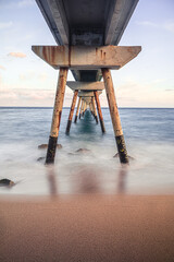 long exposure of the waves under the bridge