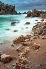 long exposure against the rocks on the beach