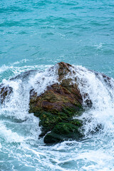 waves crashing against rocks