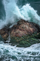 waves crashing against rocks