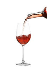 Pouring wine into glass on white background