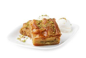 Delicious baklava with crushed nuts and ice cream isolated on white