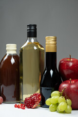 Different types of vinegar. Pomegranate, apple and balsamic vinegars in bottles