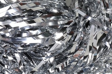 Shiny silver tinsel as background, closeup view
