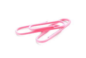 Two pink paper clips isolated on white