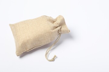 One beige burlap sack on white background