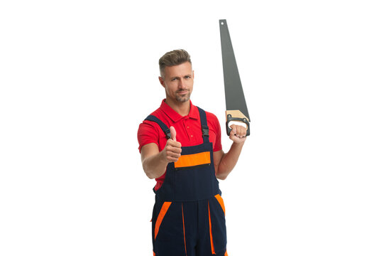 Workman man hold repair saw tool. Woodsman sawing. Carpenter builder working. Handsaw. Man worker with saw show thumb up. Carpenter with handsaw isolated on white. Builder workman in uniform