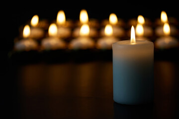 Candlelight Serenity. A peaceful arrangement of glowing candles against a dark backdrop,