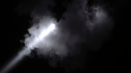 Fototapeta premium Light Beam Piercing Smoky Darkness: A Dramatic Monochrome Study