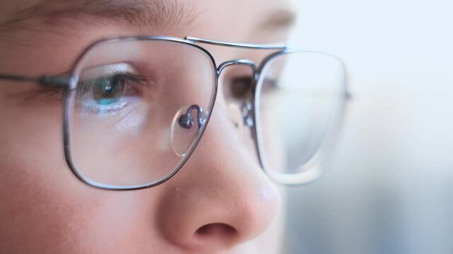 Close up portrait of a cute teenager in the eyeglasses. Care of eyes. Child looking to camera in the glasses. Medical, eyes health and school concept