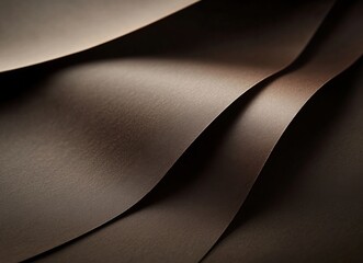 Smooth brown paper waves create an elegant texture in a subtle lighting environment showcasing depth and dimension