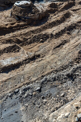 hole in the ground on the site of which a highway was started