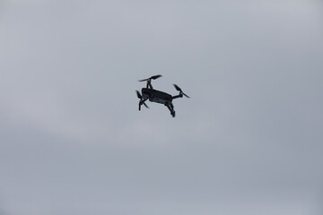 Copter in flight. Drone against the sky.
