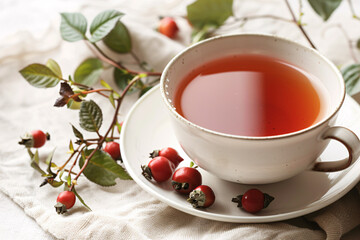 A simple, elegant cup of herbal dogrose tea, minimalits, dogrose branch with berries