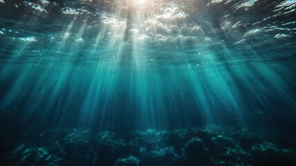 Obraz premium Sunlit ocean underwater scene with subtle light rays and marine texture