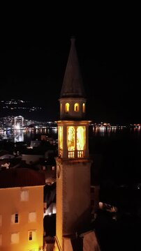Flying over old town Budva, focusing on St Johns Church and narrow streets