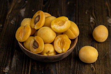 ripe soft apricot fruits on the cutting board