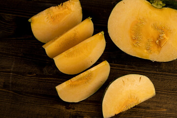 soft ripe orange pumpkin cut into several pieces