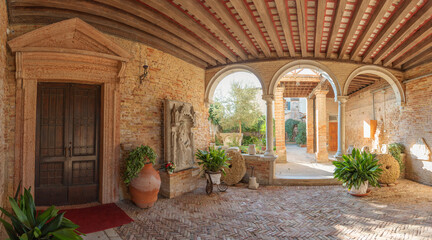 Expansive view of a historic courtyard in Mazzorbo