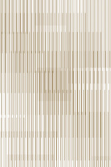 Abstract background of a pattern of brown and white lines. The lines are very thin and arranged in such a way that they appear to be moving. Illustration.