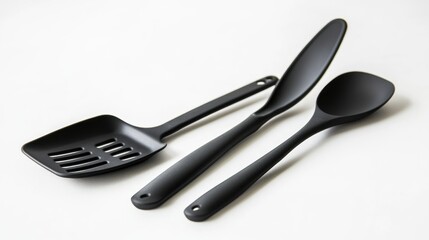Black kitchen utensils on white background