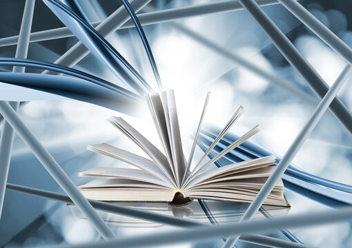Open book radiating light amidst flowing blue lines, symbolizing knowledge and creativity in a digital realm