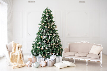 Elegant Christmas interior with a decorated tree in gold and white, wrapped gifts, a vintage beige sofa, and an armchair with a cozy knit blanket. Bright white walls create a festive, minimalism