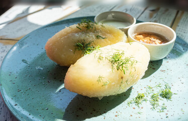 Lithuanian potato dumplings, cepelinai pancakes or kolduny, meat stuffed draniki, traditional didzkukuliai