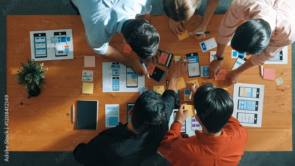 Poster top down view of business team writing idea on sticky note while planing for ux ui design for mobile