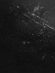 Dark gritty texture on a dark background for dramatic and moody visual projects