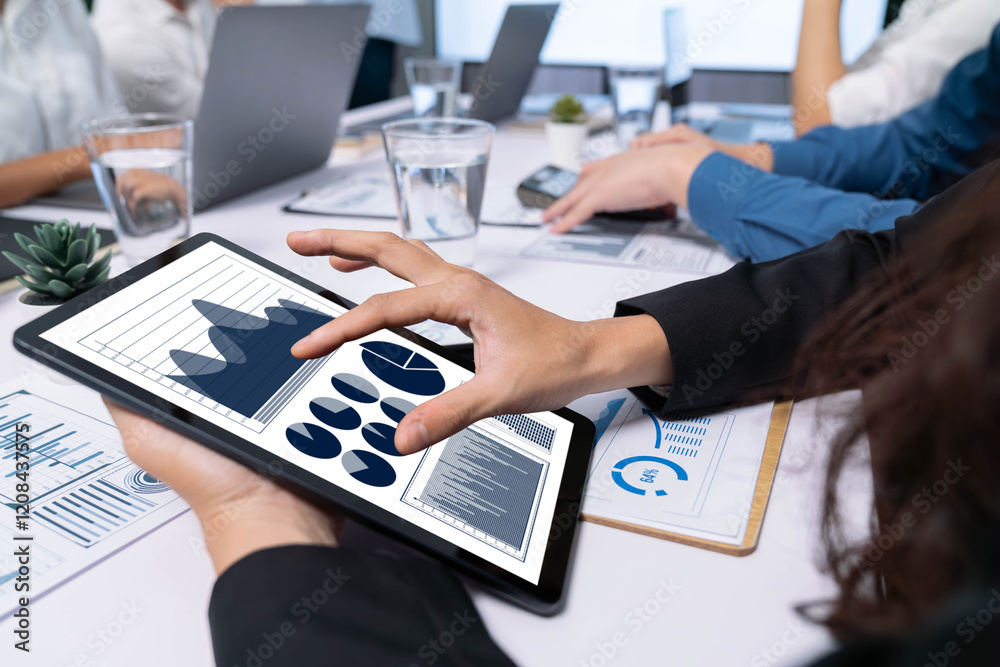 Fototapete Analyst team uses BI Fintech display tablet to analyze financial data . Business people analyze BI software technology dashboard power for insights power into business marketing planning. Prudent