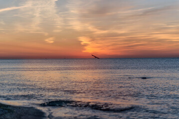 A sunset over a body of water
