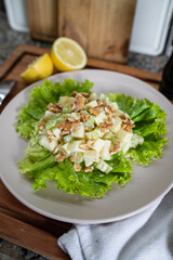 Vertical shot of classic Waldorf Salad made at home.