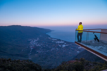 A man stands on a balcony overlooking in El Hierro island. © Maxi Perez