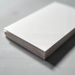 Stack of blank textured paper on gray surface, creativity and design