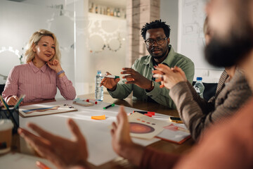 Marketing team discussing new project during brainstorming meeting