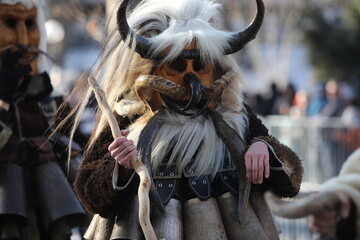 The Surva masquerade games festival in Sofia, Bulgaria. People called Kukeri parade in masks and...