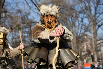 The Surva masquerade games festival in Sofia, Bulgaria. People called Kukeri parade in masks and ritual costumes, perform ritual dances to drive away evil spirits in Sofia, Bulgaria