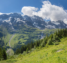 Fototapeta premium The Hineres Lauterbrunnental valley with the peaks Mittaghorn and Grosshorn and Breithorn and Holdrifall waterfall.