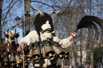 The Surva masquerade games festival in Sofia, Bulgaria. People called Kukeri parade in masks and ritual costumes, perform ritual dances to drive away evil spirits in Sofia, Bulgaria