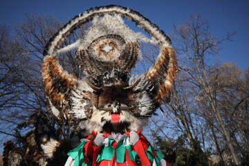 The Surva masquerade games festival in Sofia, Bulgaria. People called Kukeri parade in masks and ritual costumes, perform ritual dances to drive away evil spirits in Sofia, Bulgaria