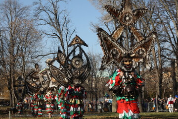 The Surva masquerade games festival in Sofia, Bulgaria. People called Kukeri parade in masks and ritual costumes, perform ritual dances to drive away evil spirits in Sofia, Bulgaria