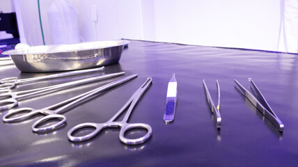 Surgical instrumentation on a black stretcher