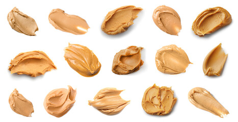 Many strokes of peanut butter on white background, top view