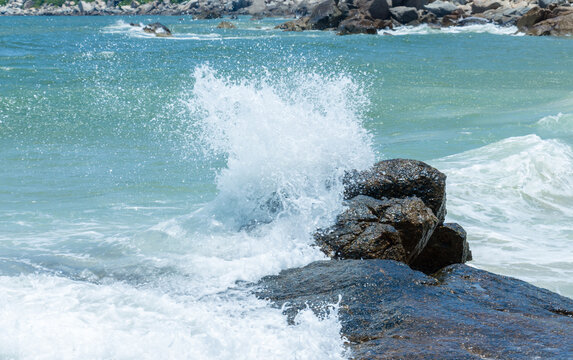 waves crashing on rocks