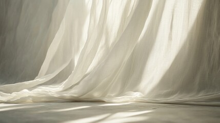 Obraz premium Ethereal Flowing White Fabric Draped Gracefully on Soft Surface with Delicate Shadows and Warm Light Creating a Tranquil and Serene Atmosphere