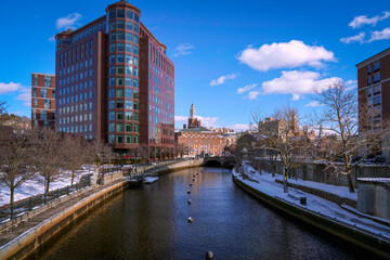 Providence City downtown skyline and buildings along the Providence River in Rhode Island, USA: A winter cityscape with snow