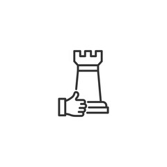 Business strategy concept: hand holding chess rook icon symbolizing leadership and decision-making