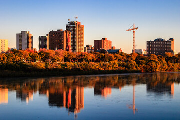 A city skyline with a large crane in the background