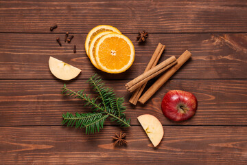 Composition with ingredients for tasty mulled wine on wooden background